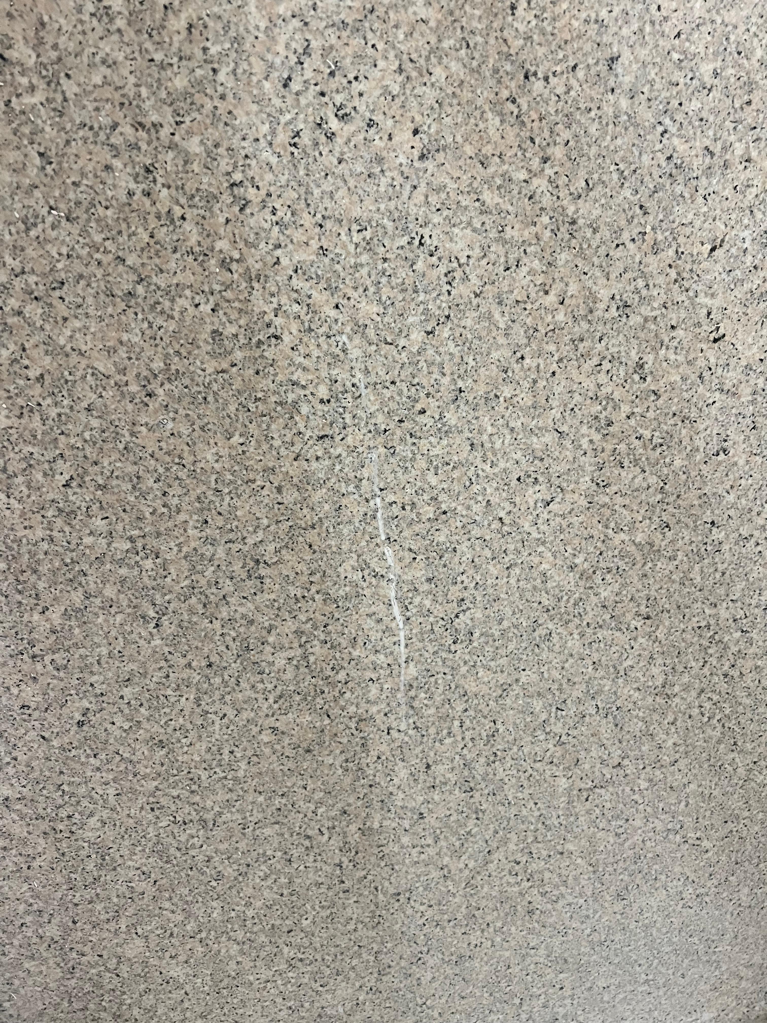 Wall in shower not thoroughly scrubbed 