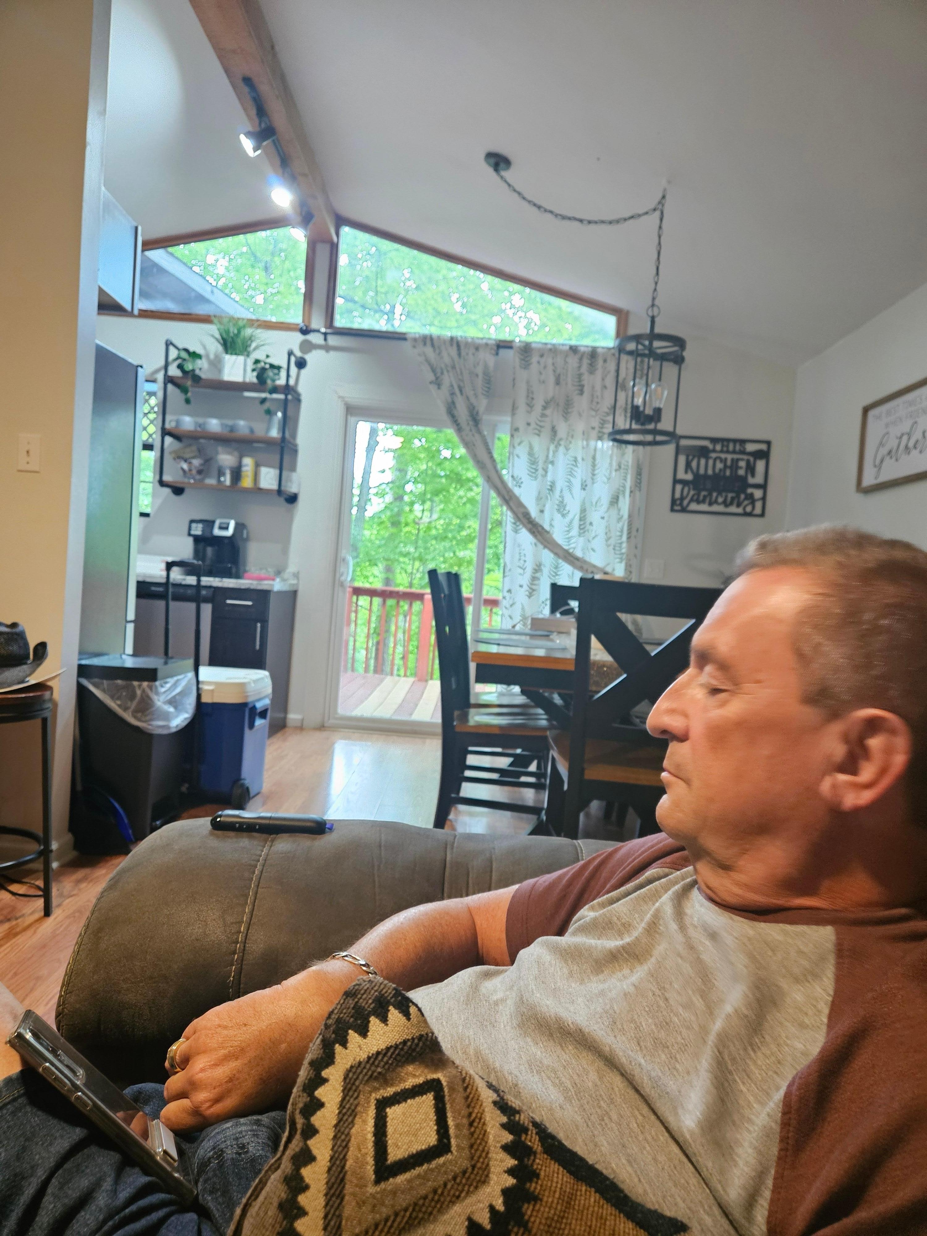 My husband enjoying the comfy sofa!