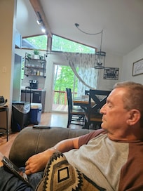 My husband enjoying the comfy sofa!