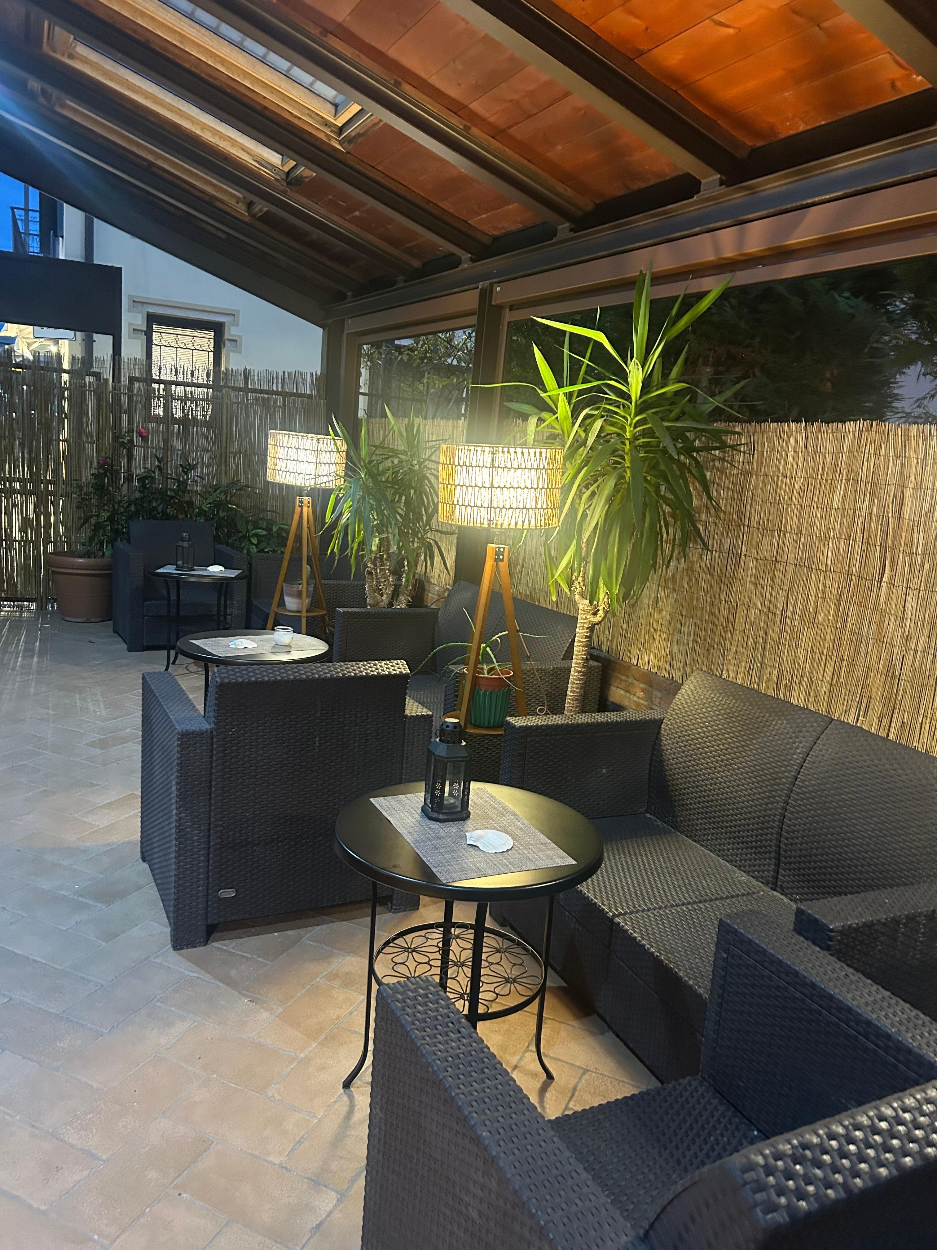 Outside sitting so cute. They had the cushions out during the day 