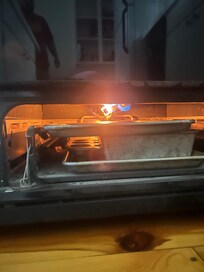 Oven seemed unsafe to use as flame was visible and bottom drawer didn’t fully close.
