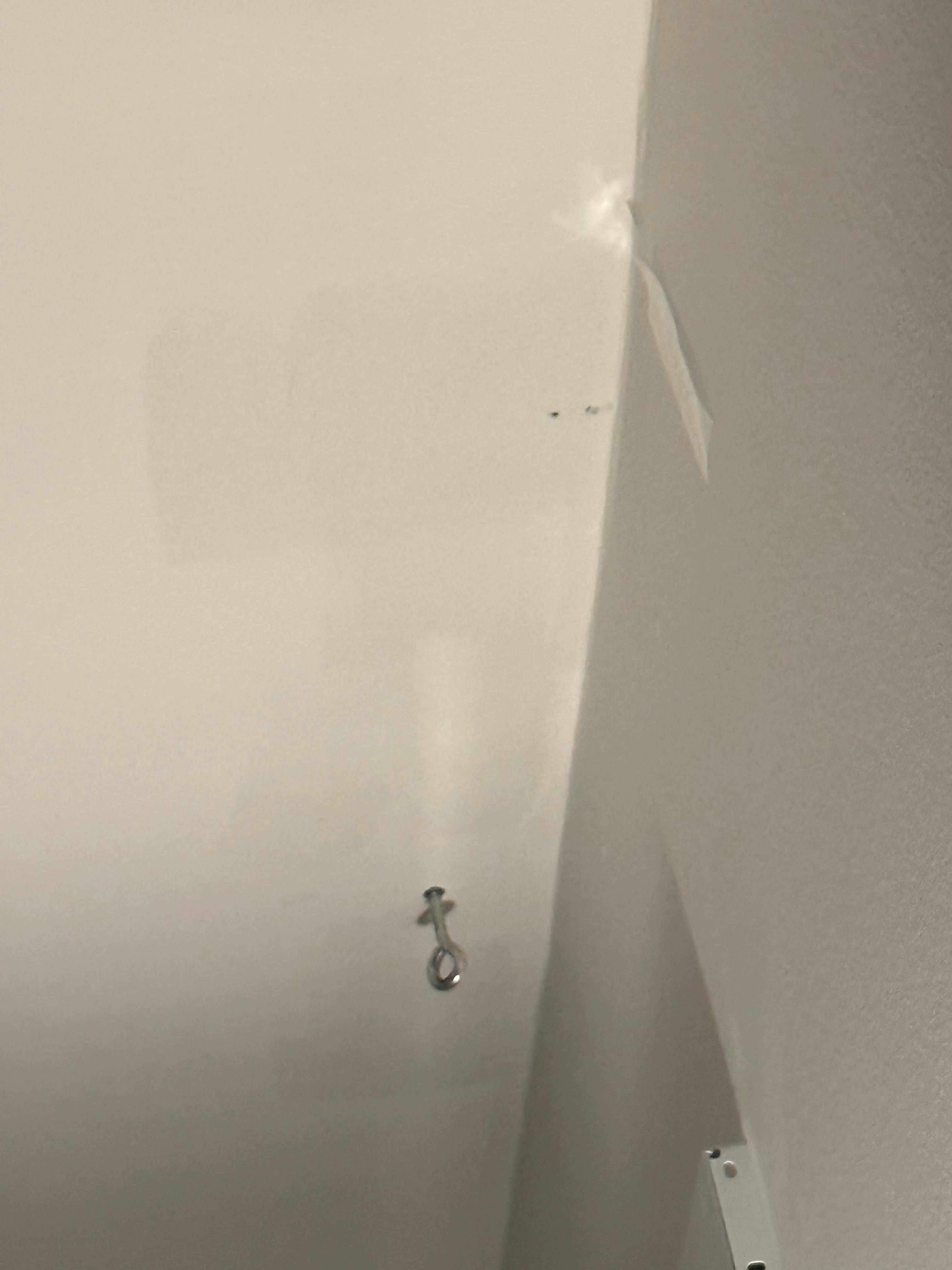 Master bedroom (one of the ceiling hooks & tape that was still stuck to wall) 