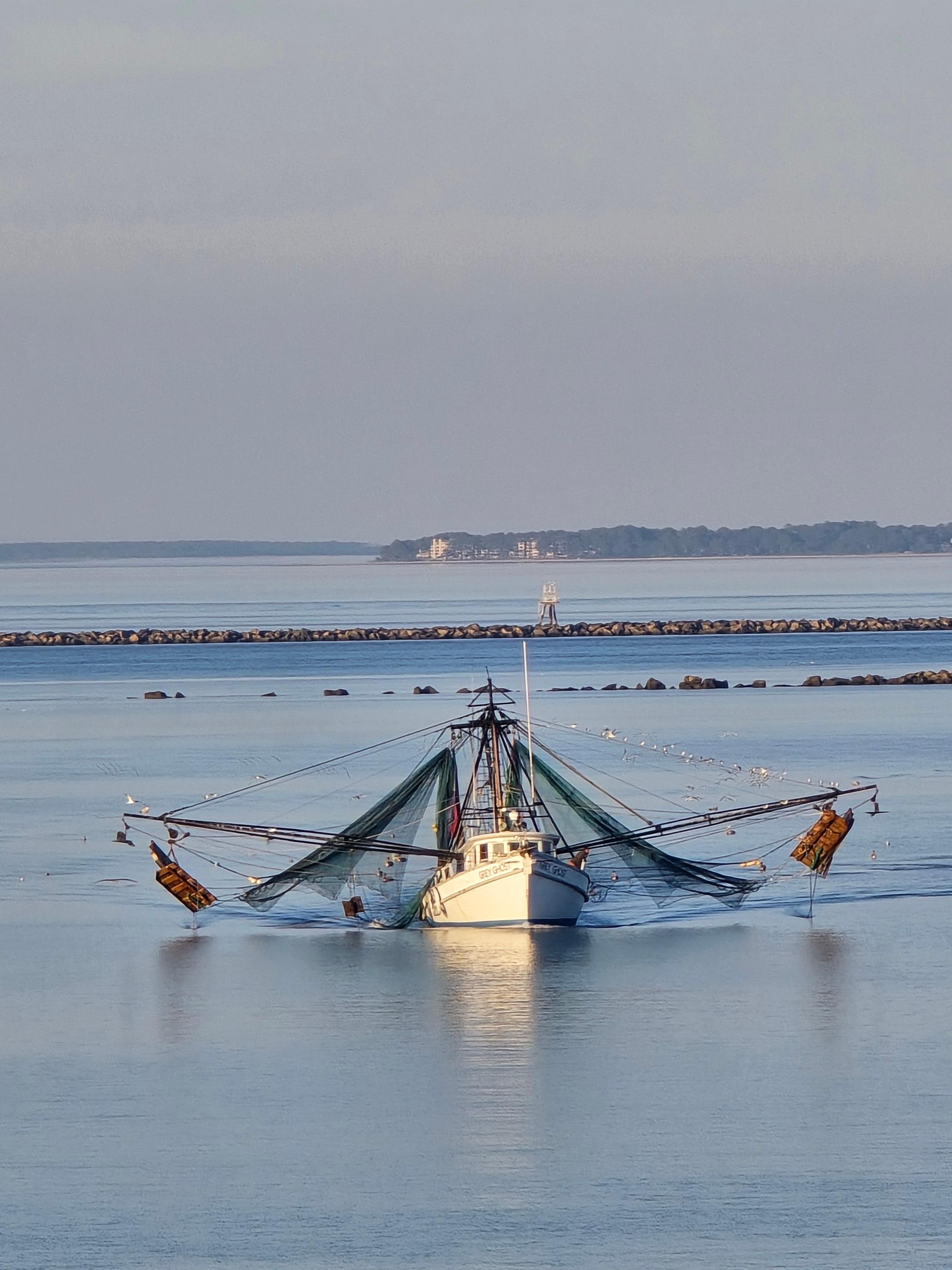 Shrimp boat passing by condo