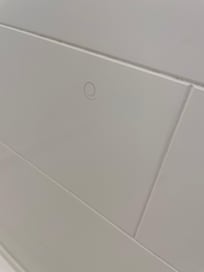 Pubic hair on the shower wall