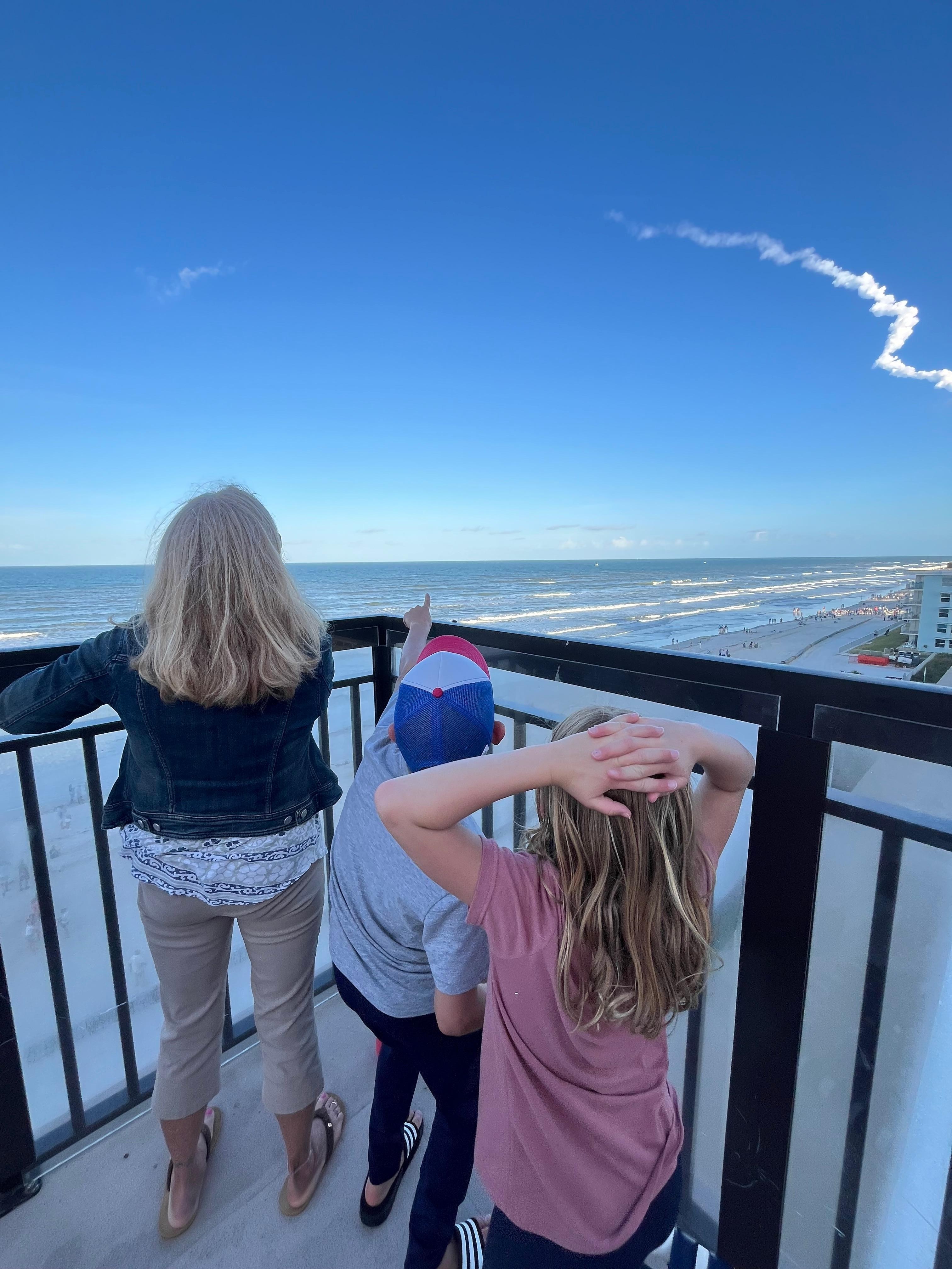 Me and my grandkids watching Artemis II lunar launch from the rooftop pool. Great view!