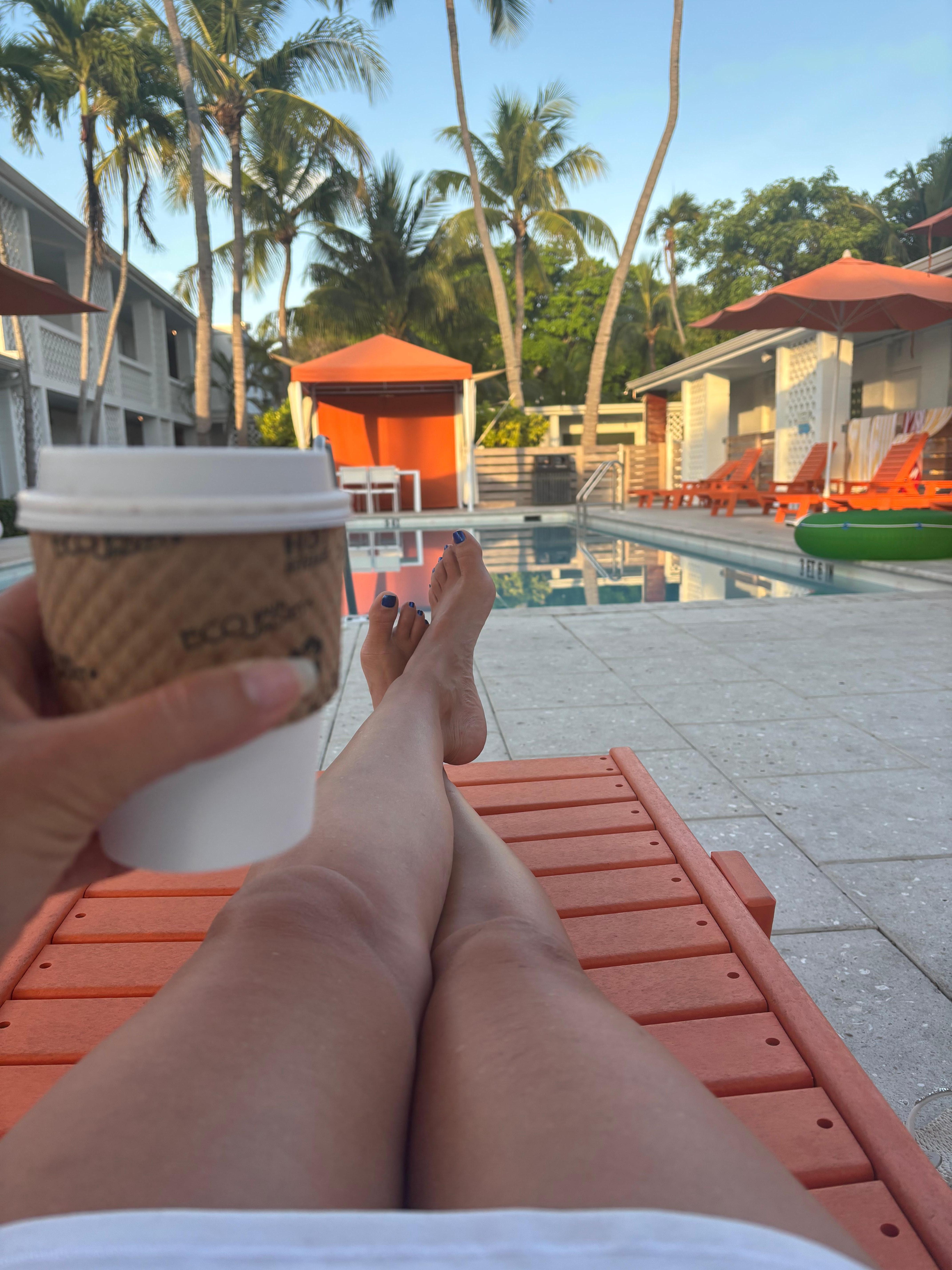 The palm trees and pool area are so relaxing. Great spot for morning coffee.