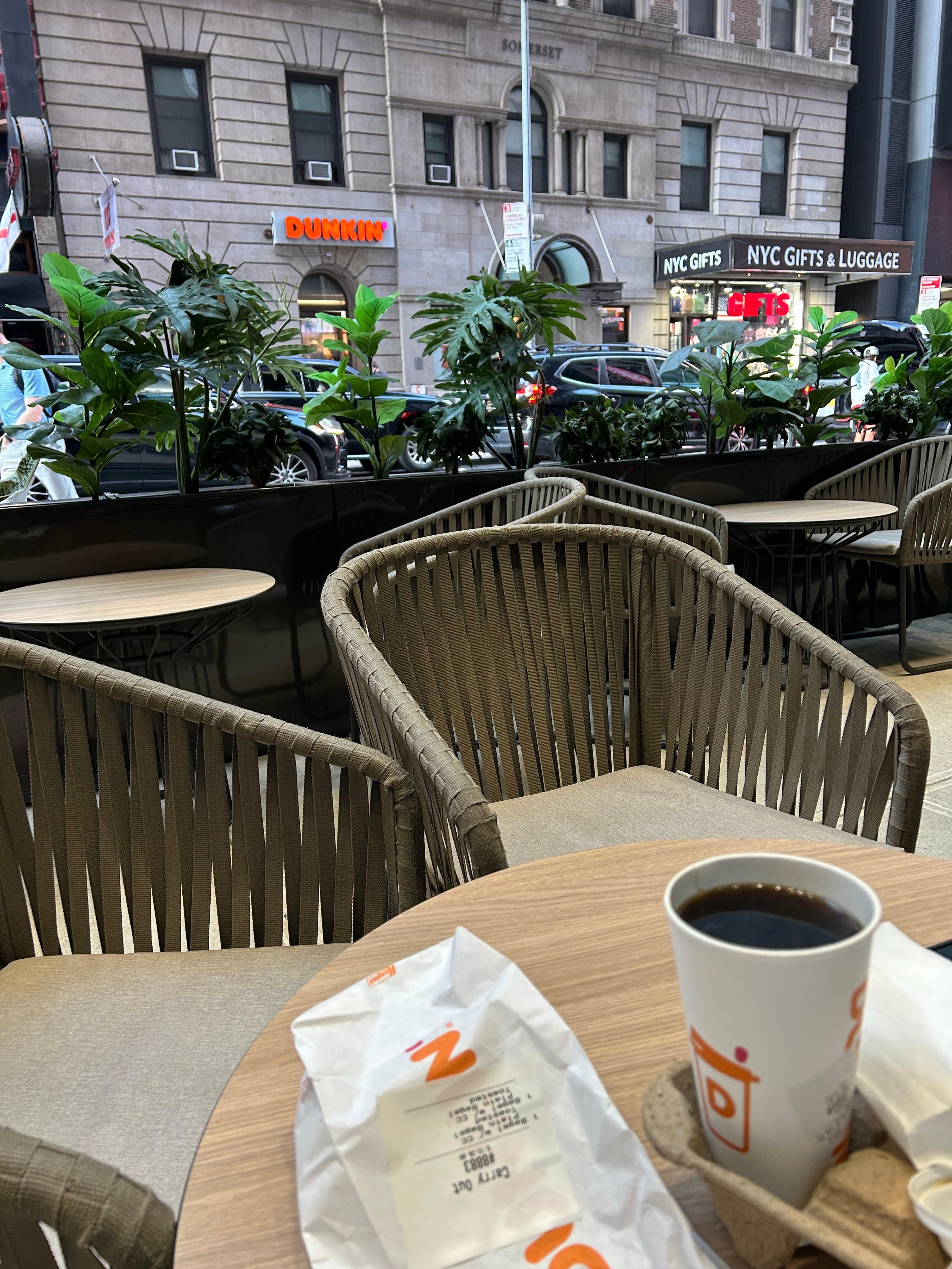 Outdoor seating in front of hotel.