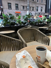 Outdoor seating in front of hotel.