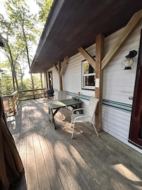 View of sitting area under roof on deck.