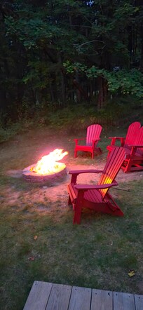 Lovely Adirondack chairs and lots of owner provided wood to have a fire.