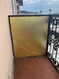 Broken glass divider on balcony