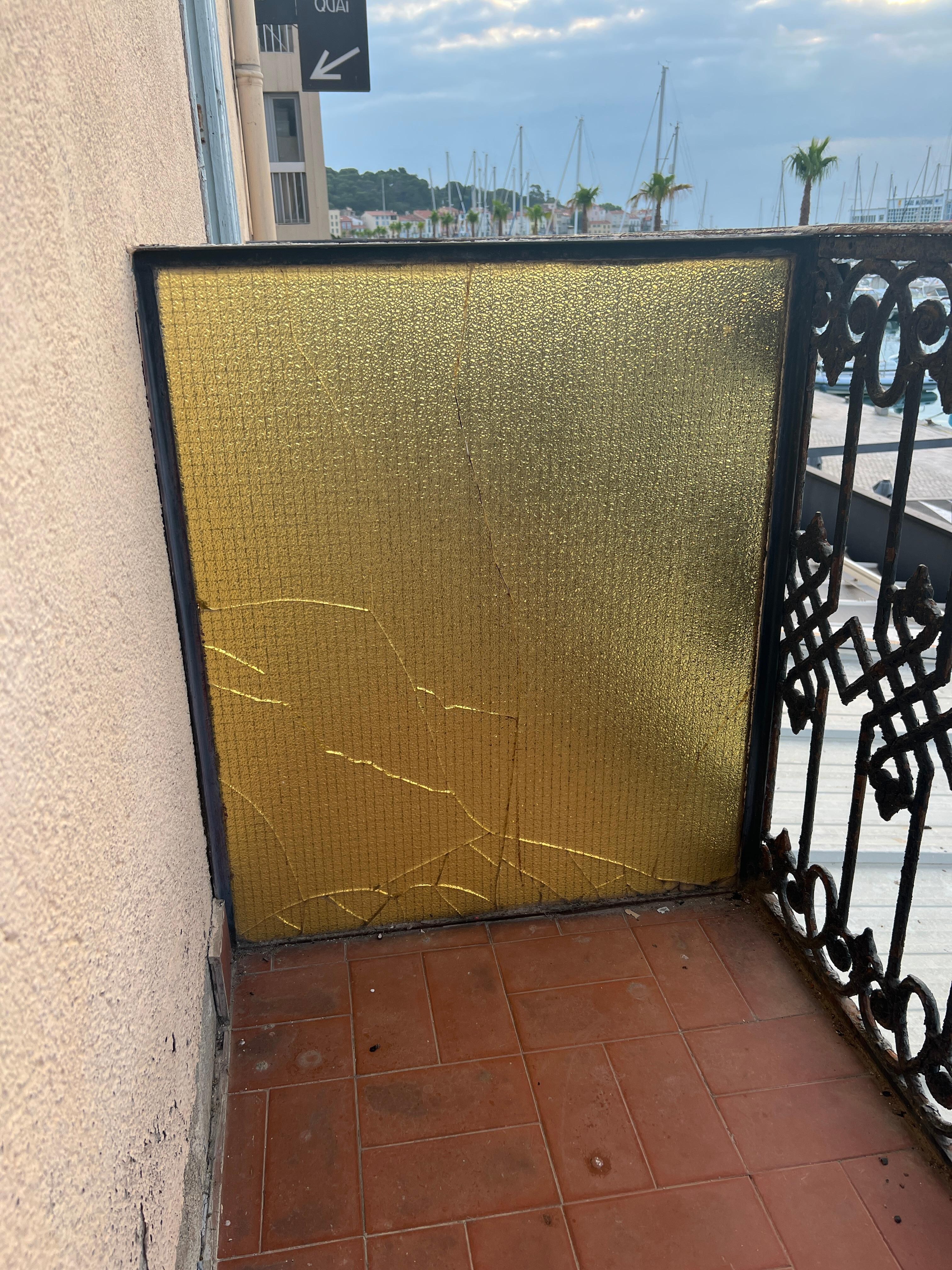 Broken glass divider on balcony 
