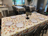 The main dining room table shown here. There used to another white dining table that got removed but they had some in storage and chairs