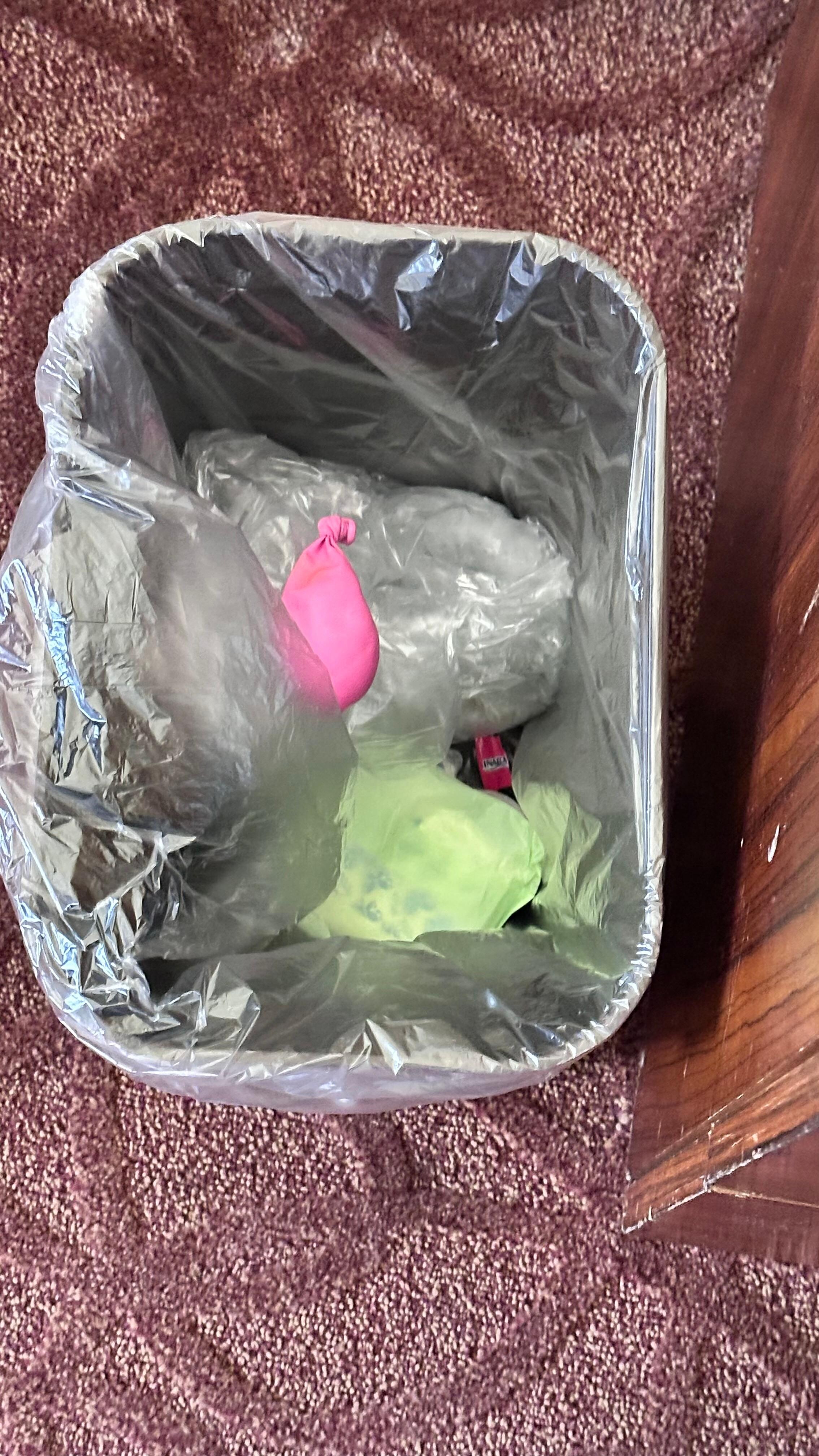 Ballon from behind bed; unused sanitary pad found in drawer 