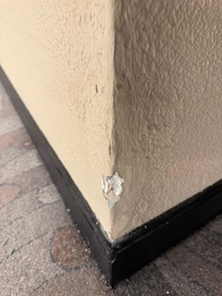 A torn wall corner.