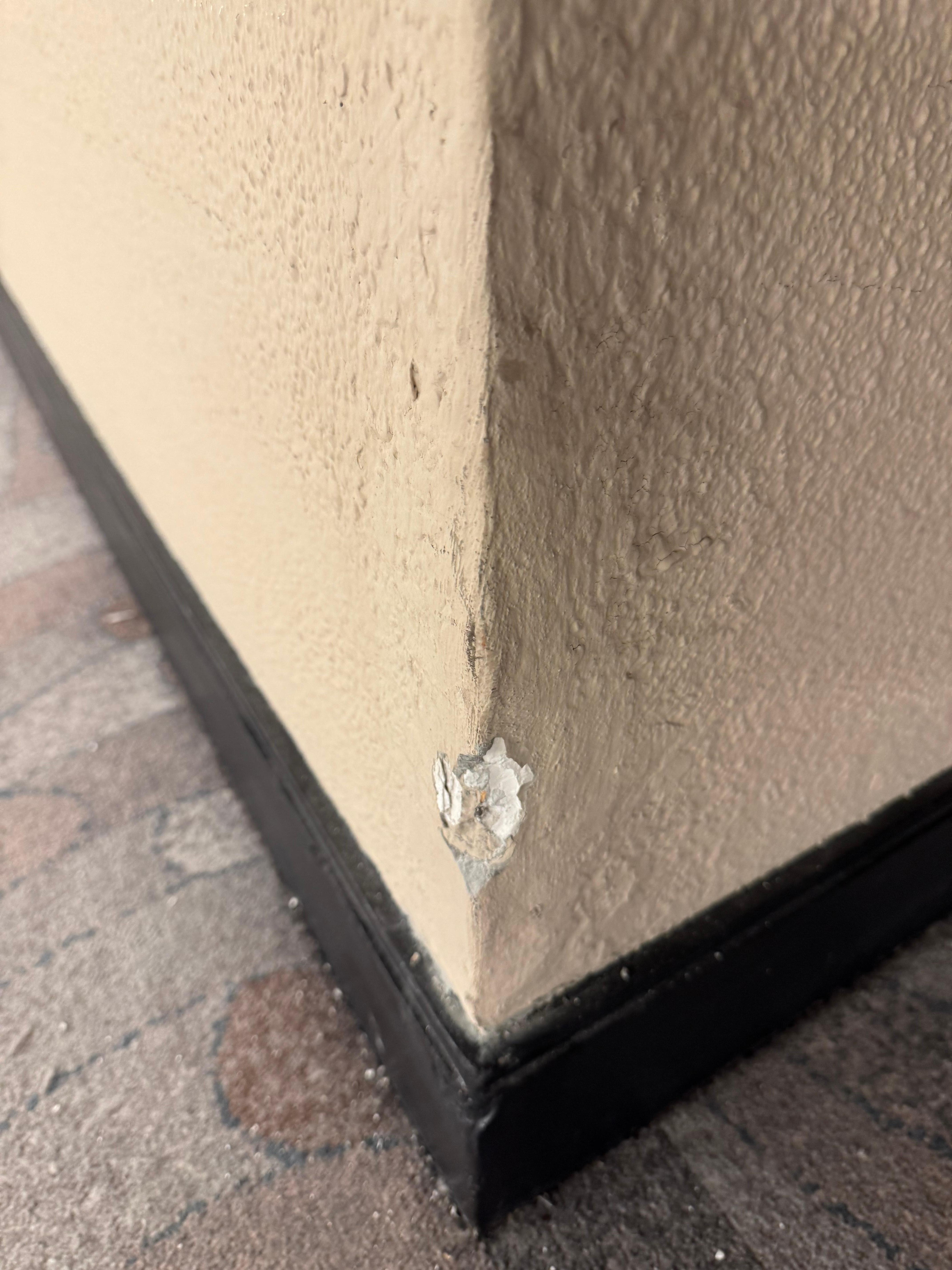 A torn wall corner.
