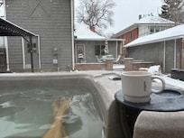 Coffee in the hot tub with snow falling. Perfect start to the day.