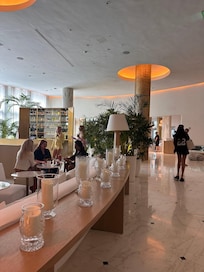 Amazing lobby that is a complete escape into white and green heaven