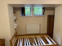 The single bed under the cushion. Open windows for fresh air. We saw rodent droppings outside and saw a mouse in the garden and were nervous nothing blocks things from entering basement. Very dusty and lots of spiders.