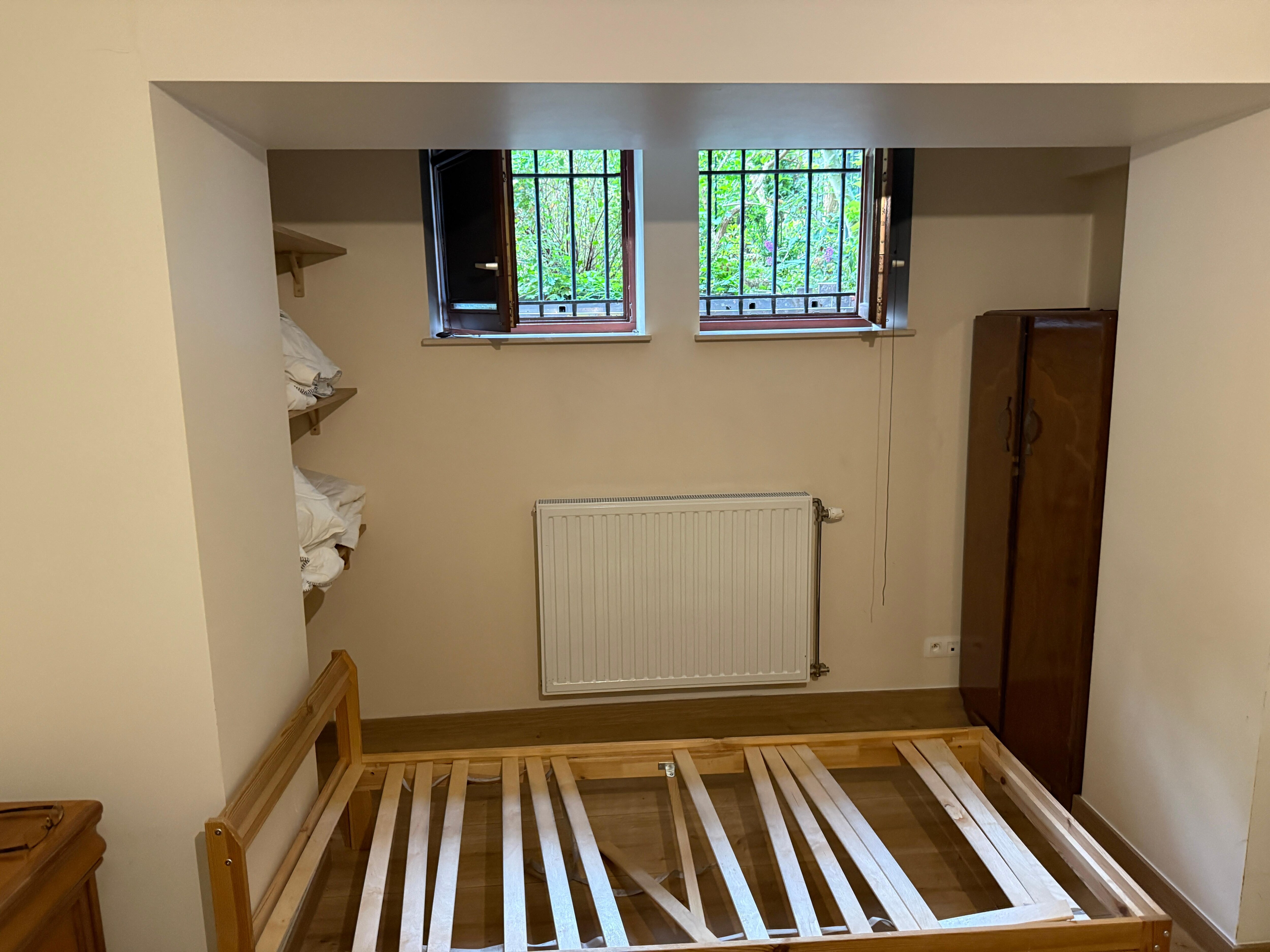 The single bed under the cushion. Open windows for fresh air. We saw rodent droppings outside and saw a mouse in the garden and were nervous nothing blocks things from entering basement. Very dusty and lots of spiders.