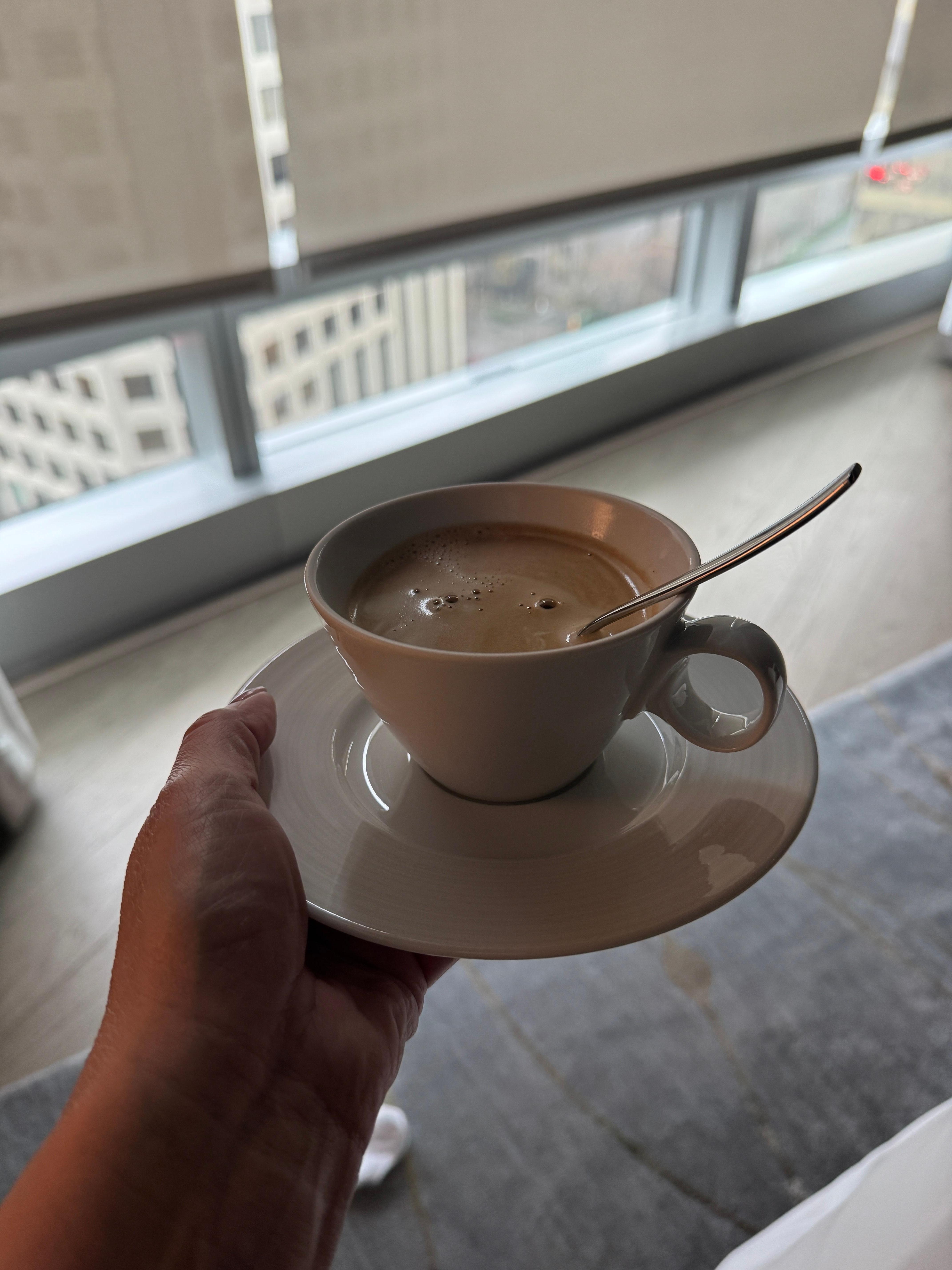 Fancy coffee in bed with morning automatic shades, great view 