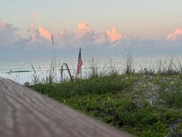 From walkway to beach from pool area