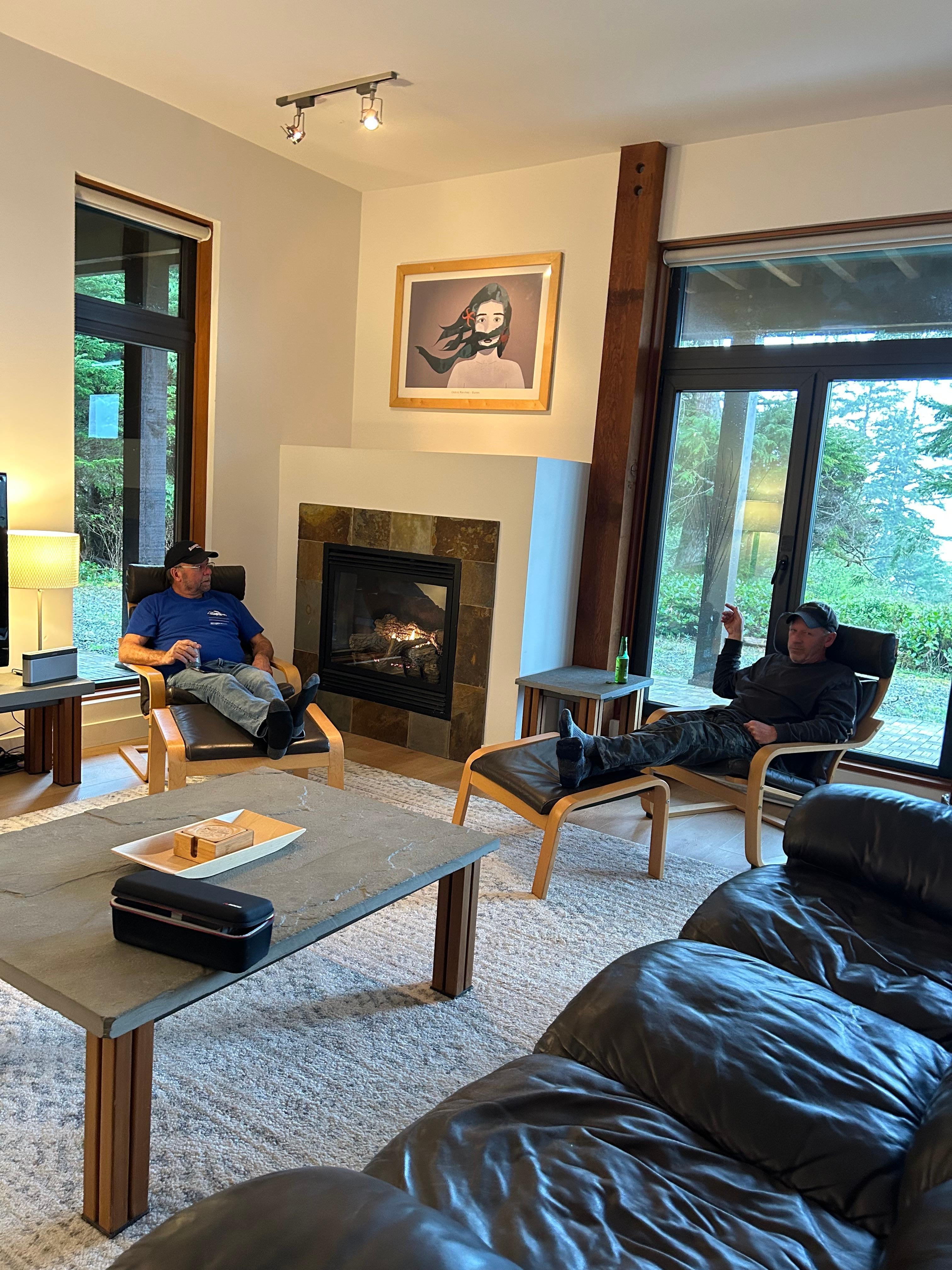 Living space with fireplace and ocean view. 