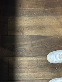 Dusty floor with crumbs of something