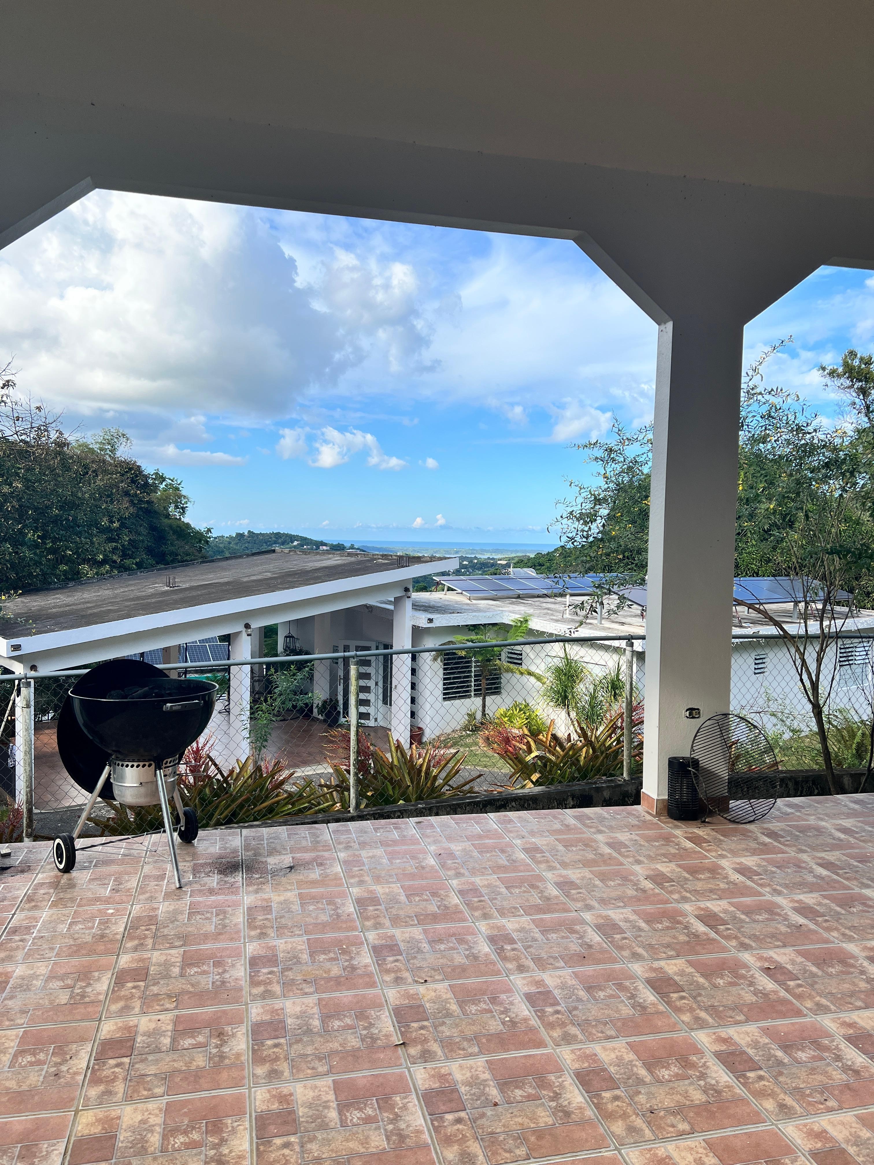 View down the mountain all the way to the ocean from the carport door!!