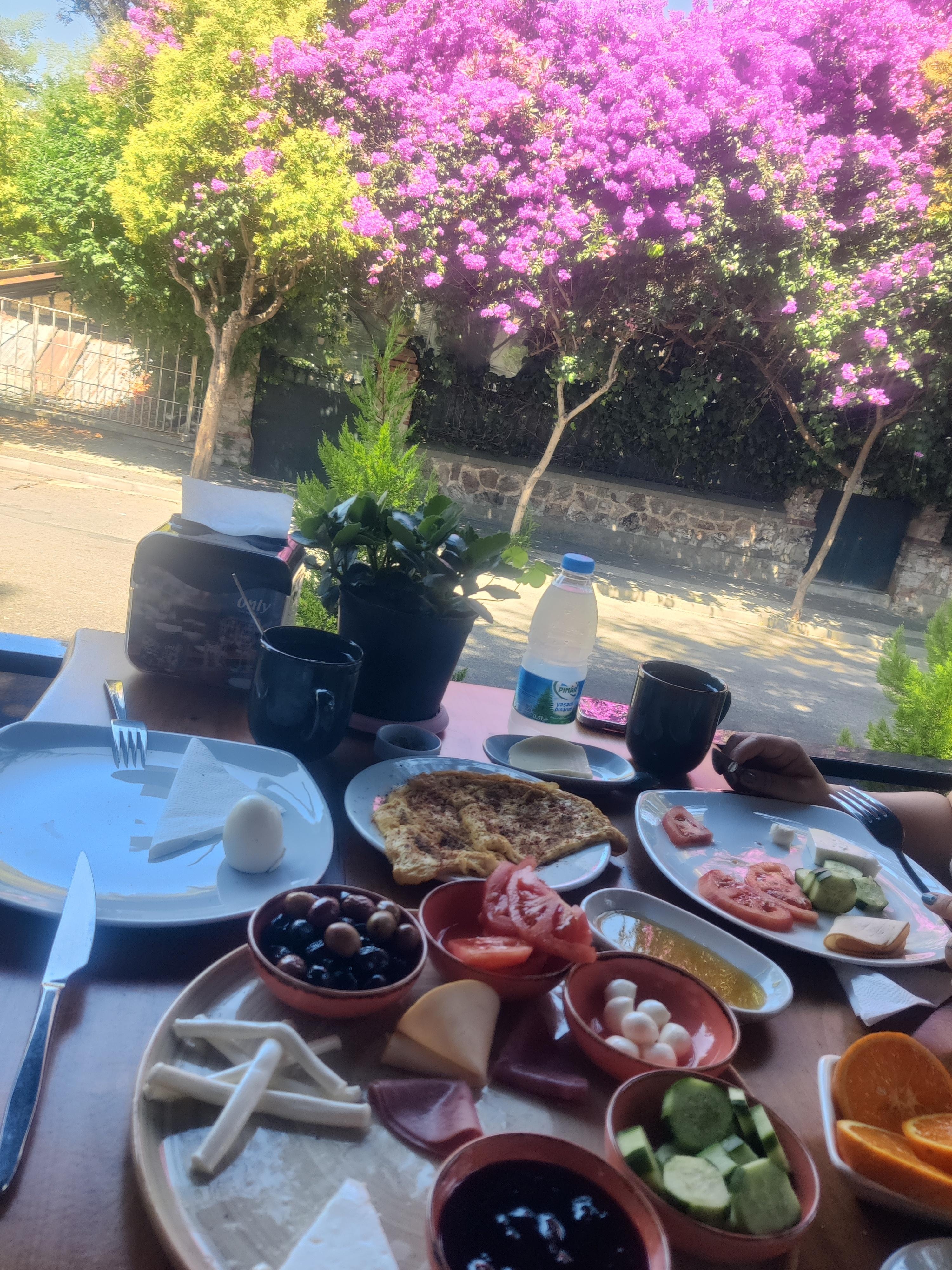 enjoying breakfast on the patio, right below - in front of the rooms.