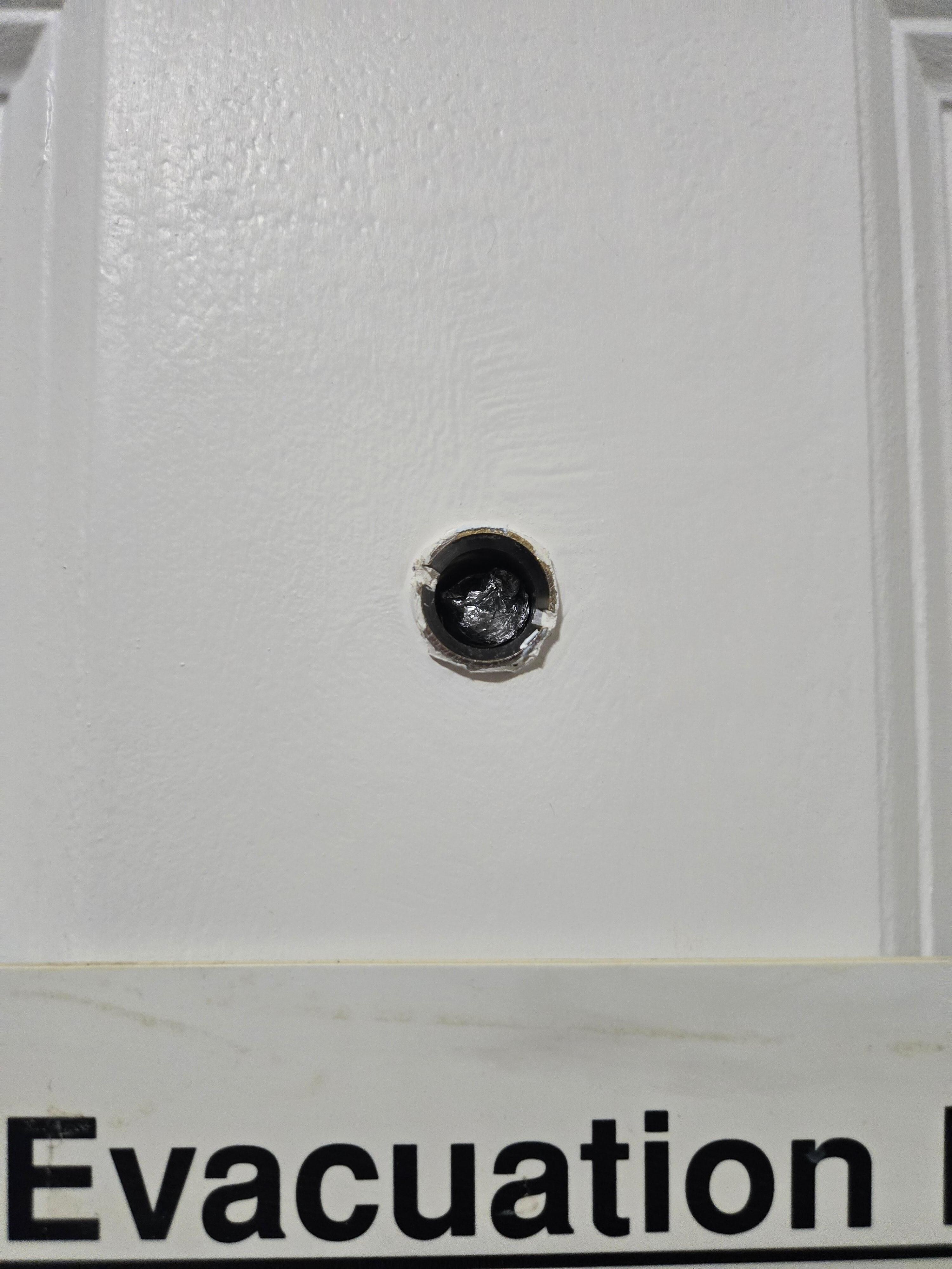 Peep hole broken with roller up aluminum foil stuck in it