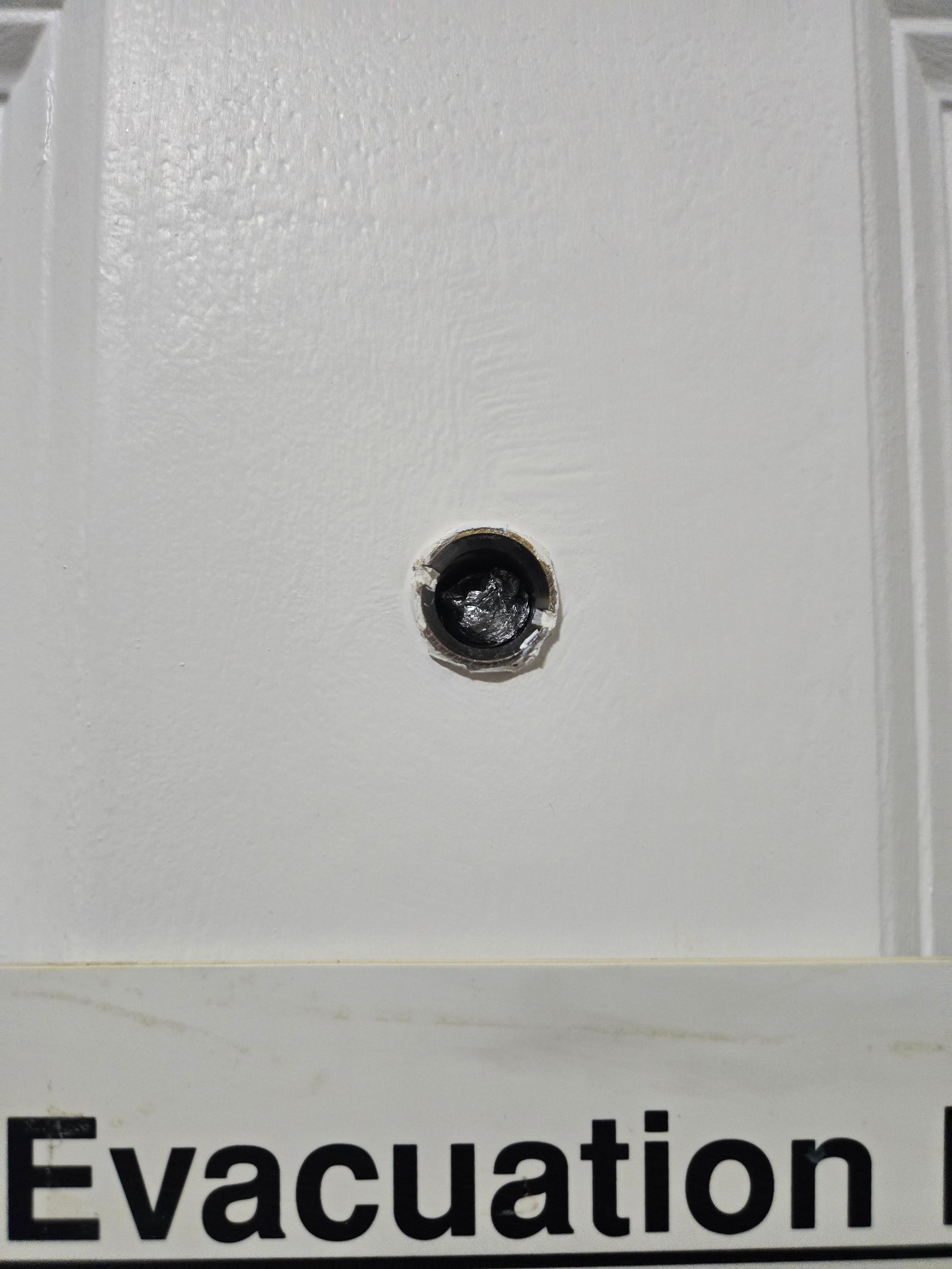 Peep hole broken with roller up aluminum foil stuck in it