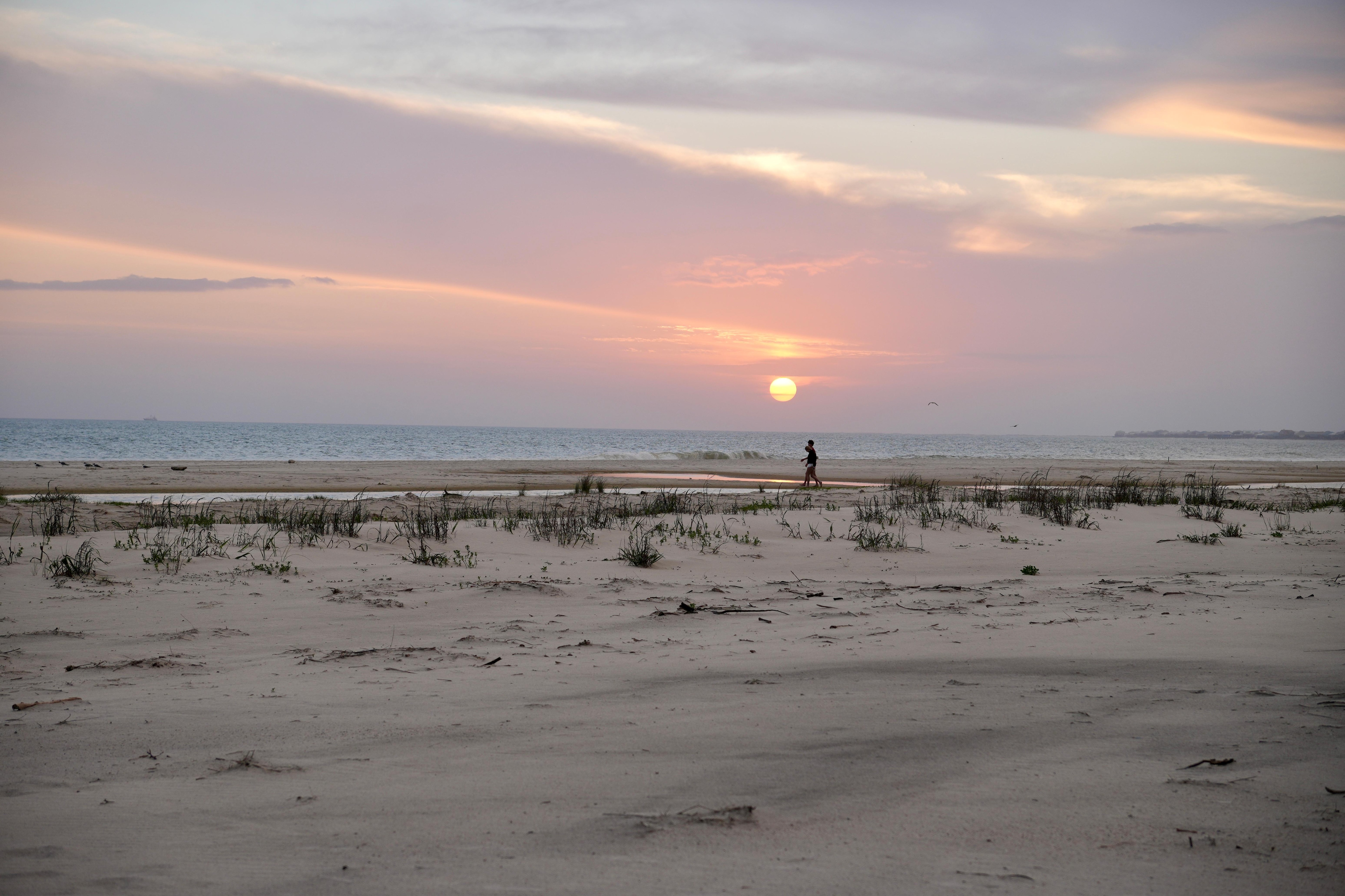 At the end of the walk from the building