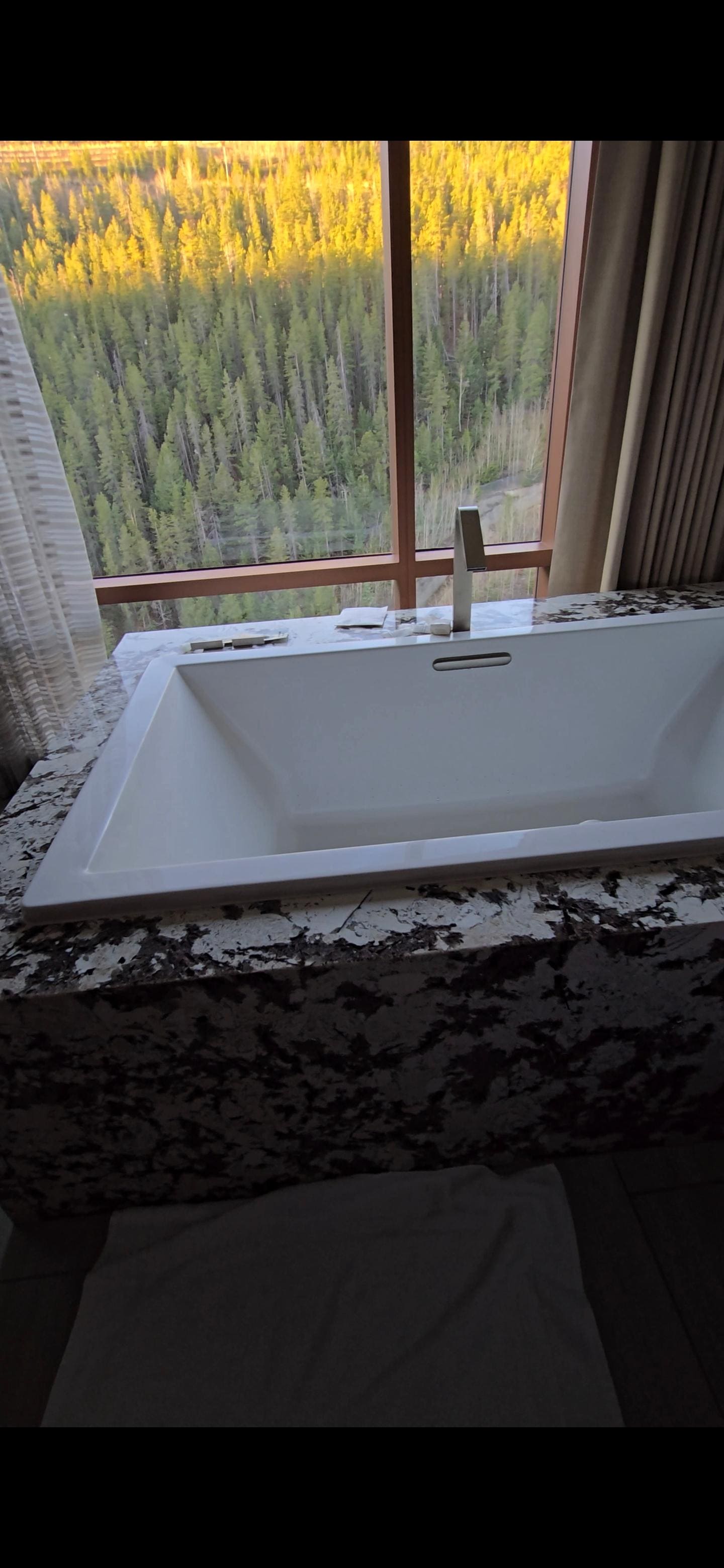 Hotub with mountain view and a tv to watch as well