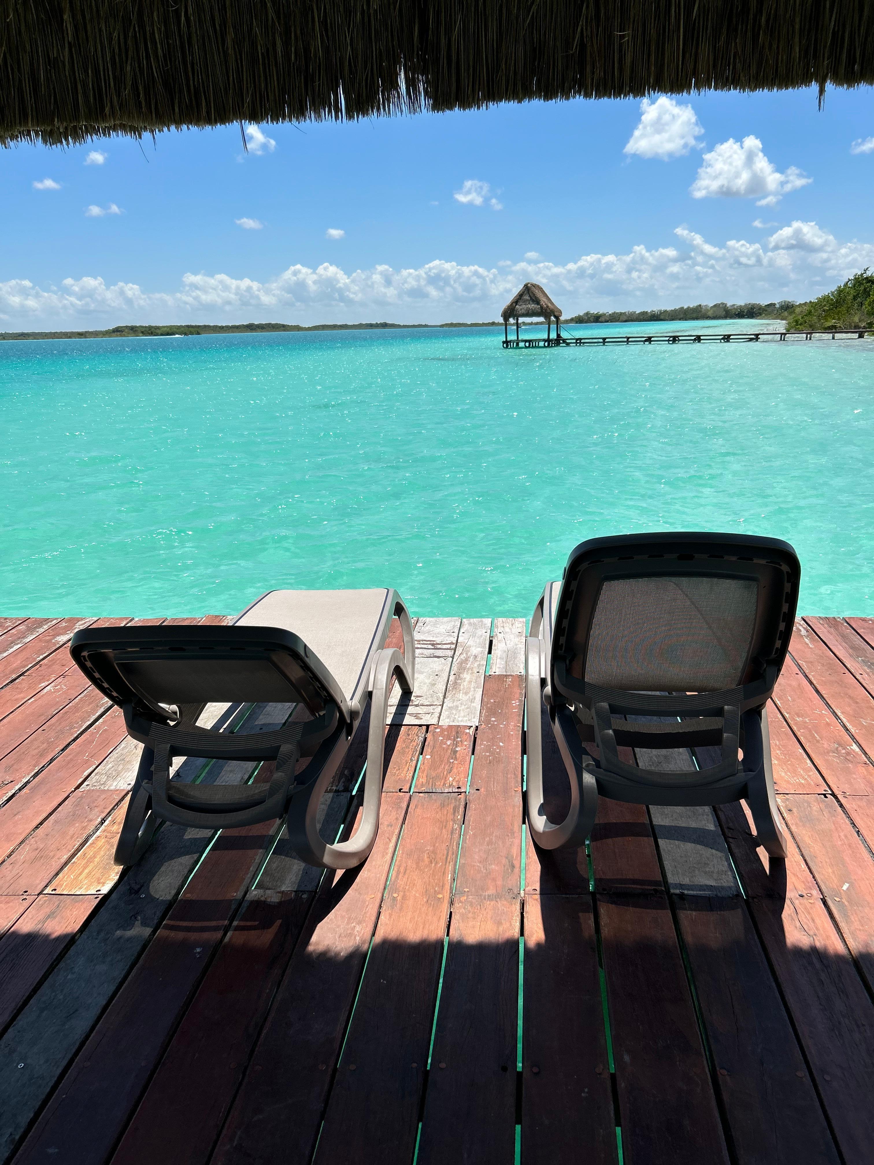 Just beyond the bar is a jetty that leads to this beautiful covered area with lounges and hammocks.