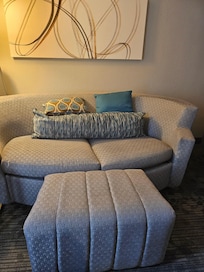 Room was nice but $5 a day parking for a vehicle pass that must be visible to the tow truck operator kept me up all night on this sofa by the window because even if you have one visible your car could still get towed if they claimed it wasn't visible
