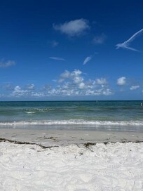Super clean beach. The beach is also not very deep so your walk is shorter. Flat, no dunes.