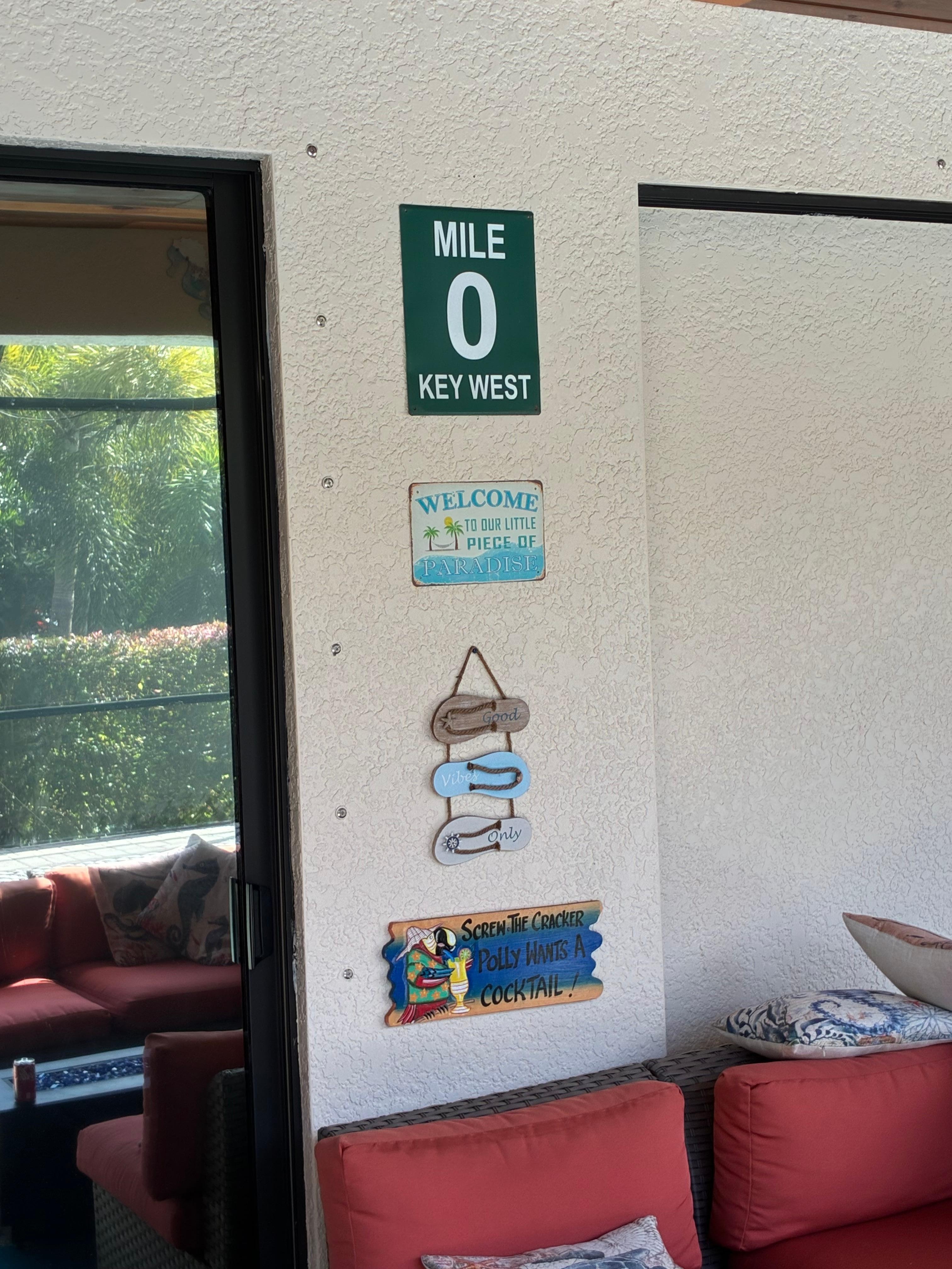Cute signs on the lanai overlooking the pool. 