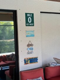 Cute signs on the lanai overlooking the pool.