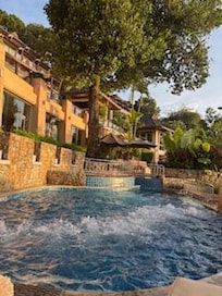 A jacuzzi next to the pool