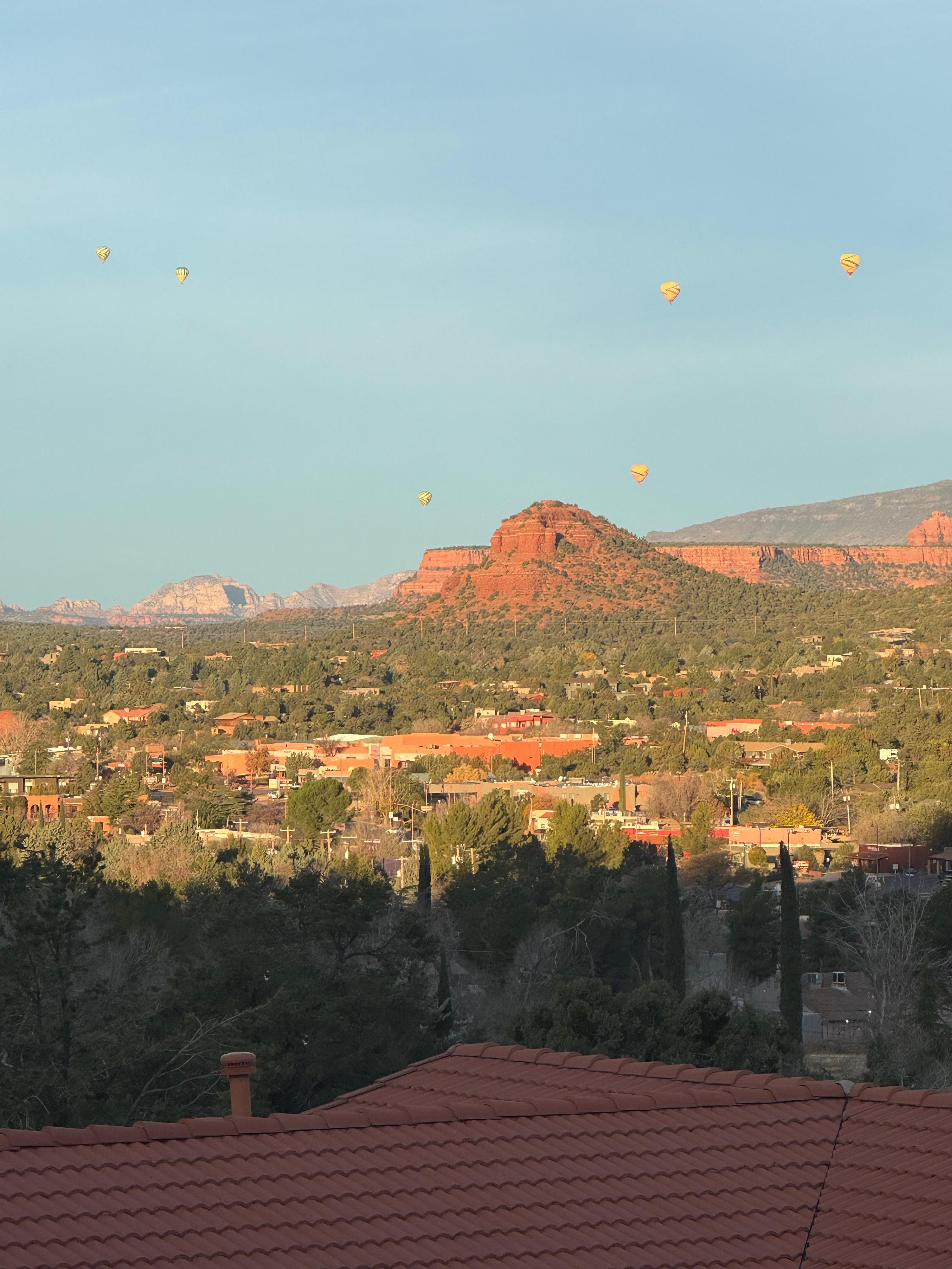Hot air balloons in the distance as we enjoy morning coffee on the patio