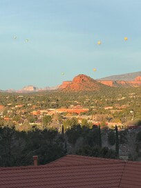Hot air balloons in the distance as we enjoy morning coffee on the patio