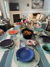 Dining space looking into the living room - plenty of room at the table for 6 with colorful fiesta plates