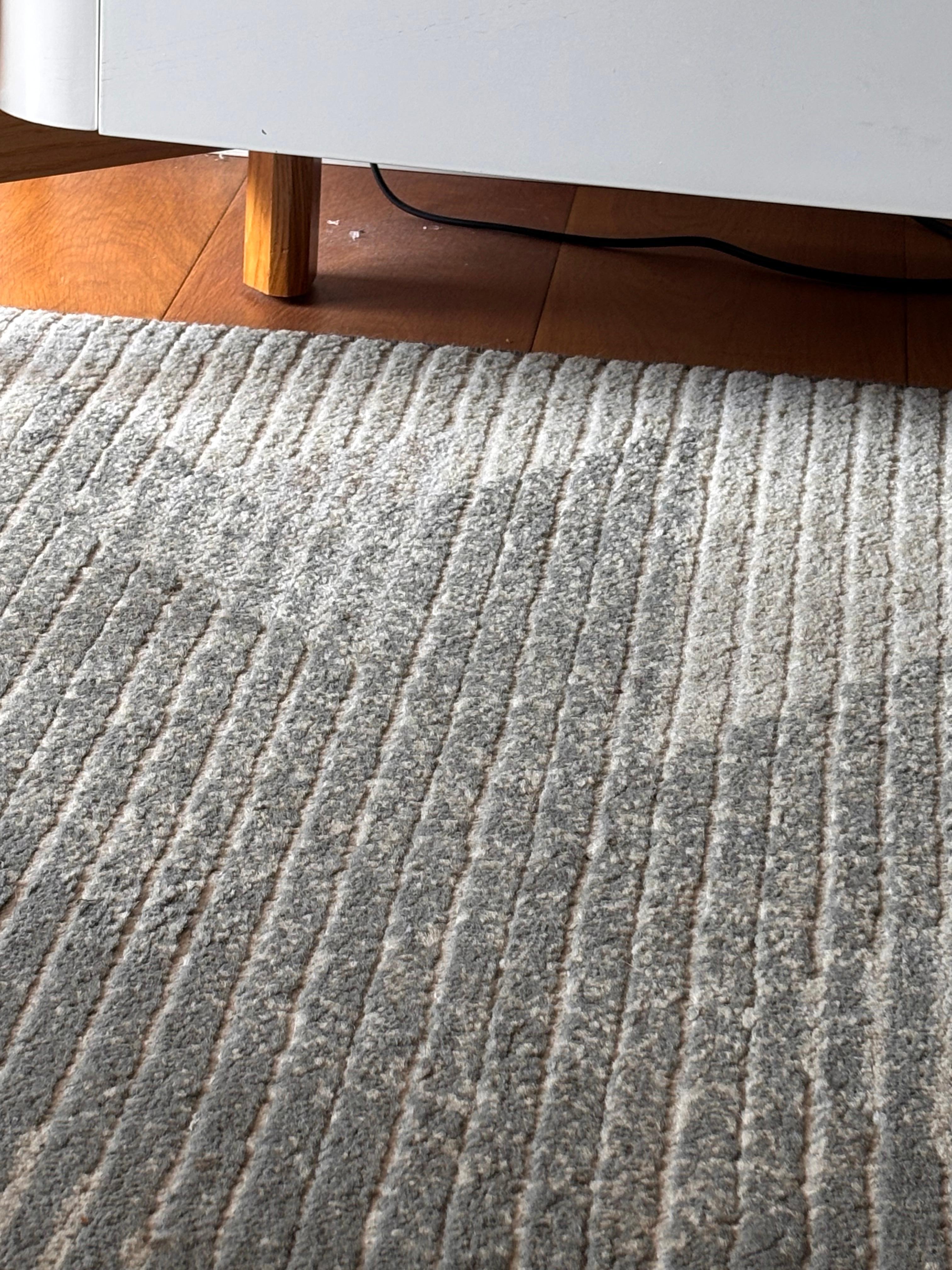 Broken glass and grime under tv cabinet