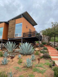 Modern Unit with private balcony overlooking grounds and pool/jacuzzi.