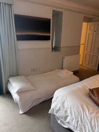 Single mattress set up on the floor near plug sockets - not a family room