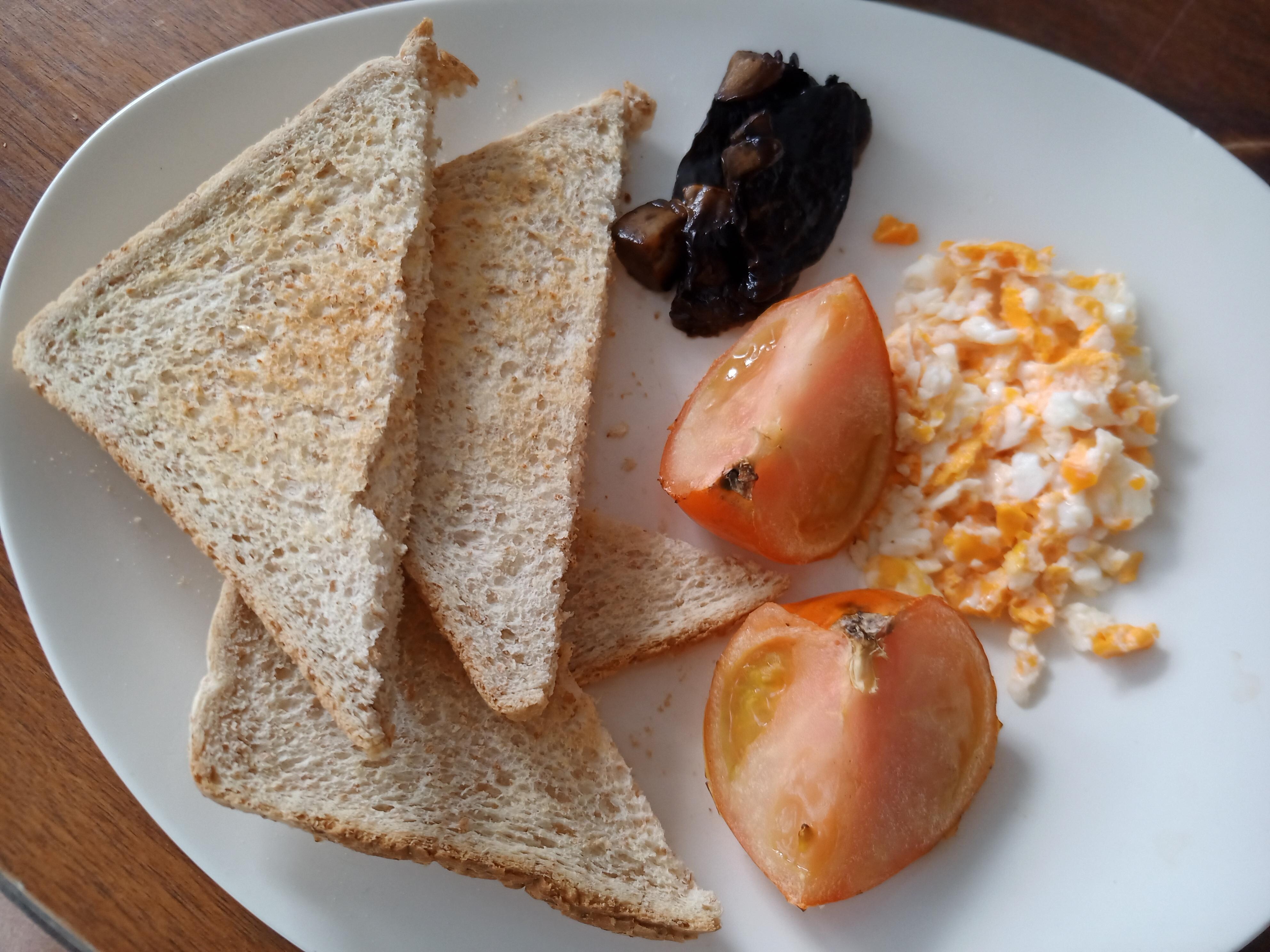 "Scrambled Eggs, Mushrooms, Grilled Tomatoes and Toast"