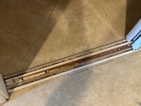 Filthy door track in closet