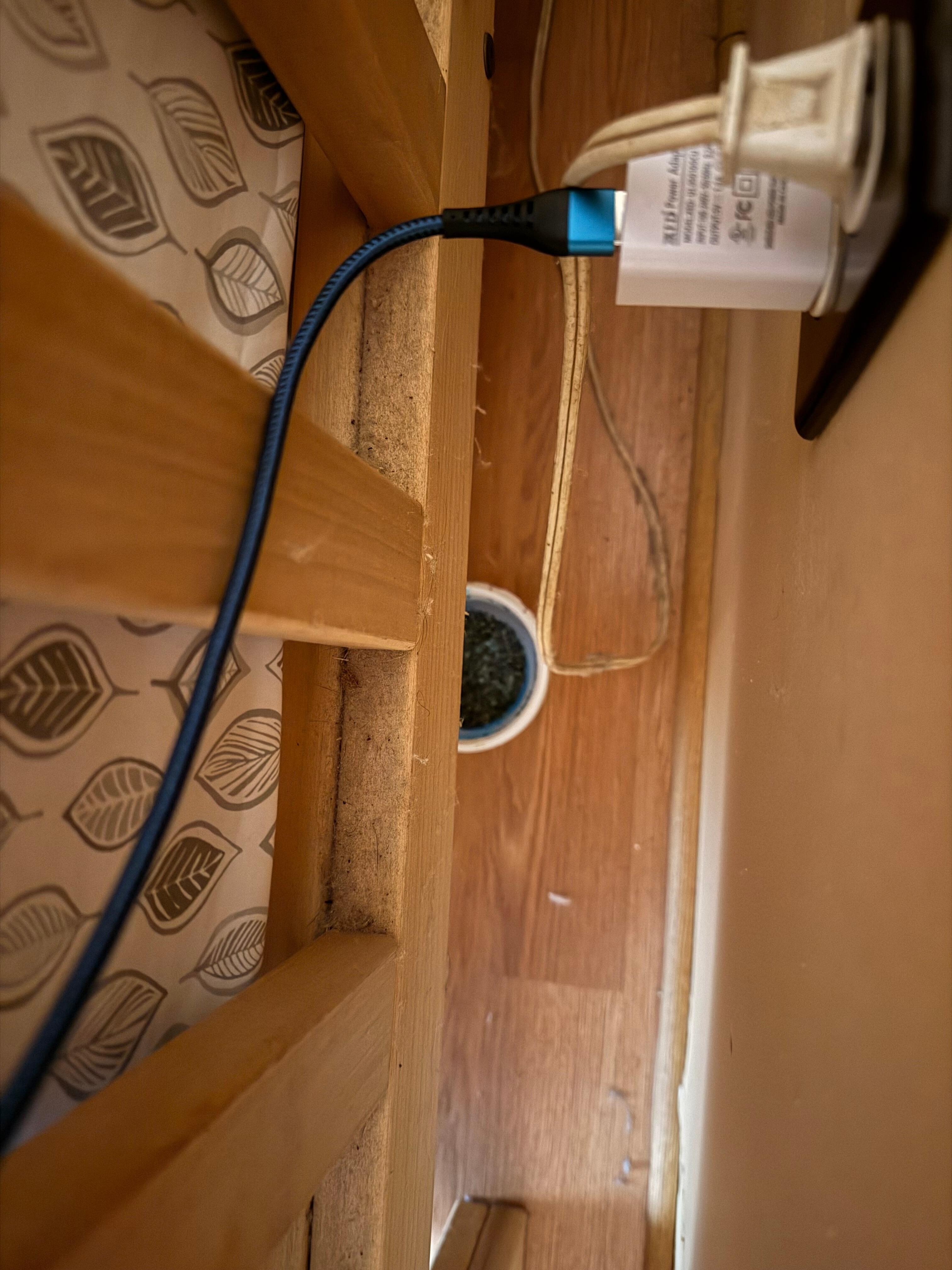 I saw this when I plugged in my
Phone charger, Behind headboard, 