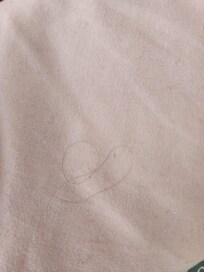 Hair imbedded in sheets.